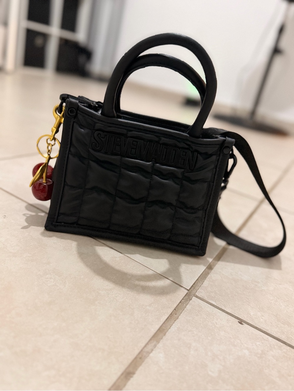Steve Madden Black Quilted Mini Tote with Cherry Charm Accent